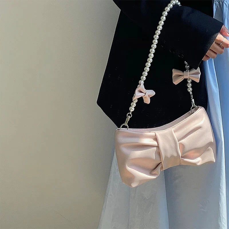 Satin clutch with pearl handle