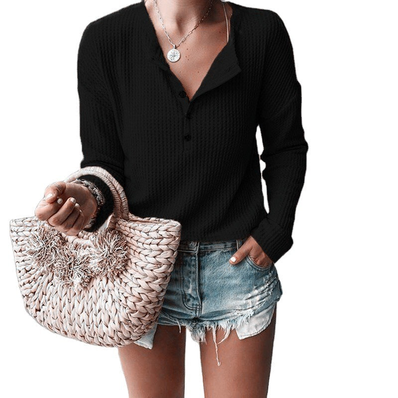 Button-up blouse with V-neck and long sleeves