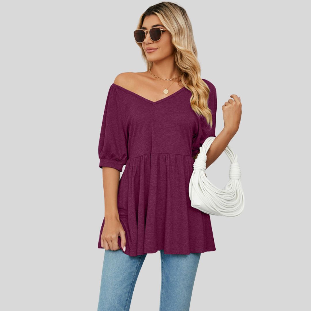 Wide flared peplum top with V-neckline