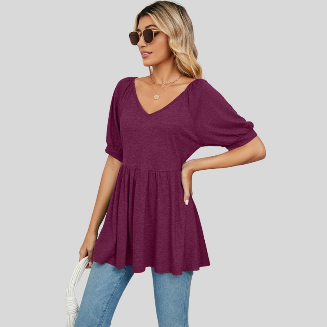 Wide flared peplum top with V-neckline