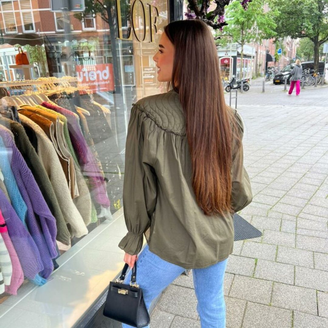 Elegant blouse with accent buttons