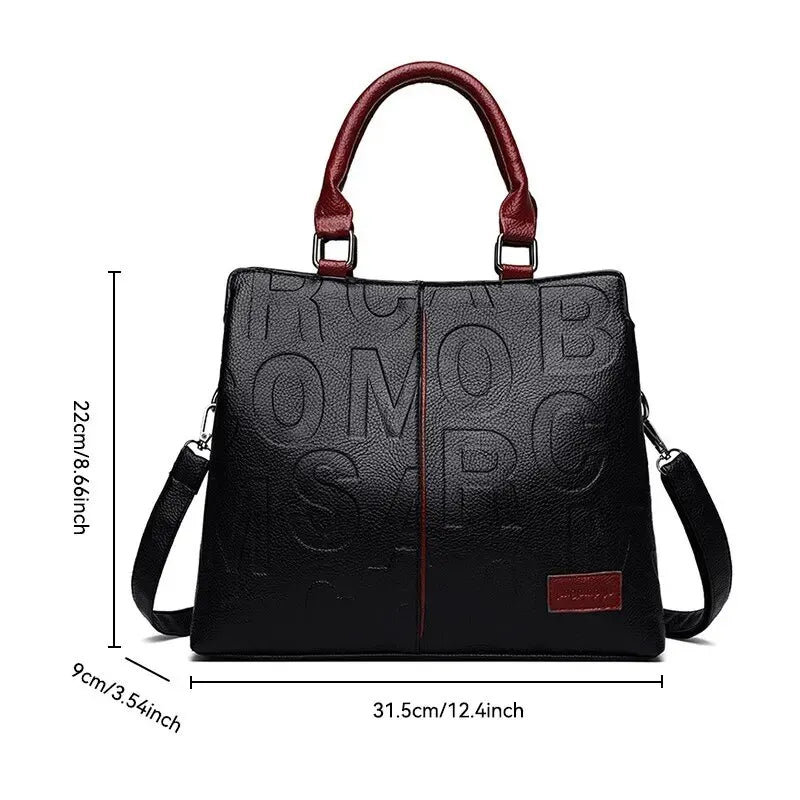 Ladies' handbag in soft leather with embossed letter design