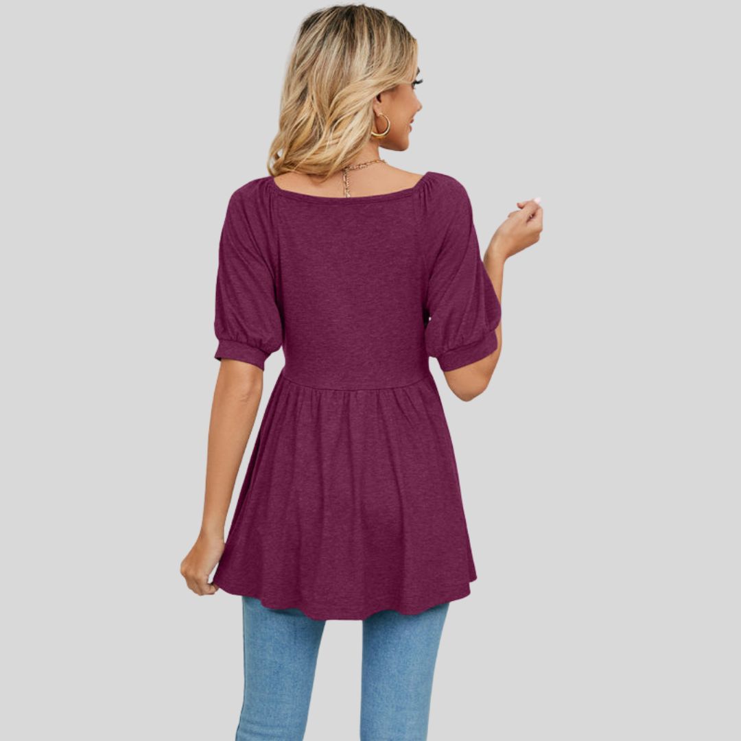 Wide flared peplum top with V-neckline