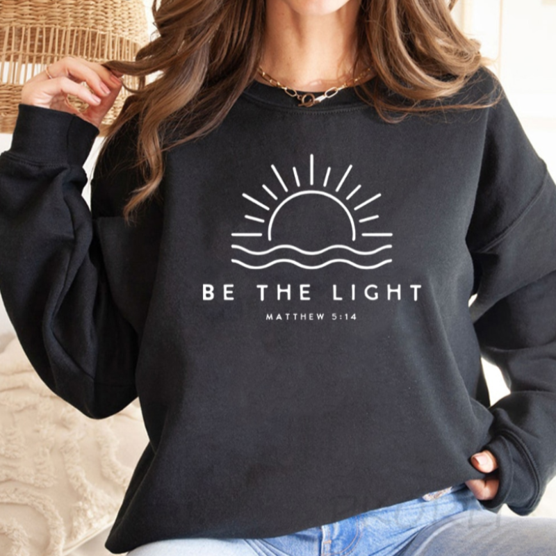 Fashionable oversized "Be The Light" jumper