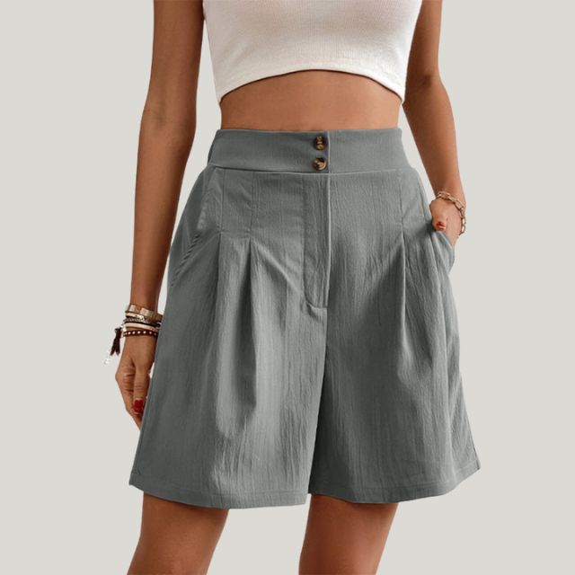 Pleated A-line skirt with button detail