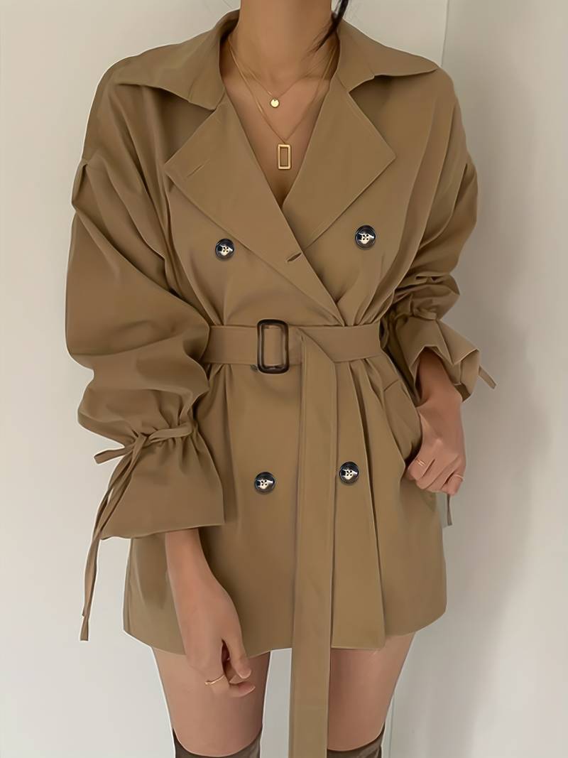 Mid-length, double-breasted trench coat with collar and belt