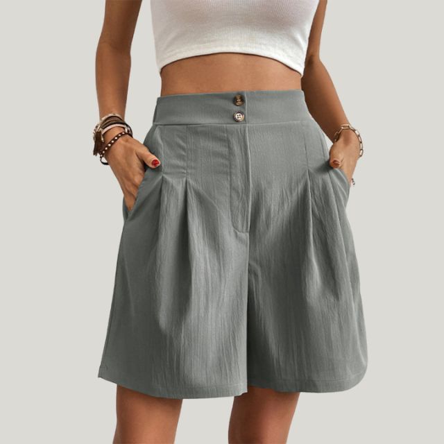 Pleated A-line skirt with button detail