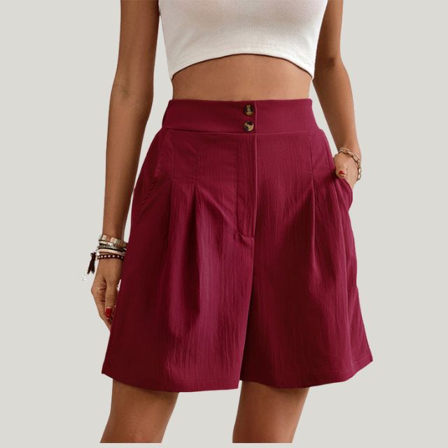 Pleated A-line skirt with button detail