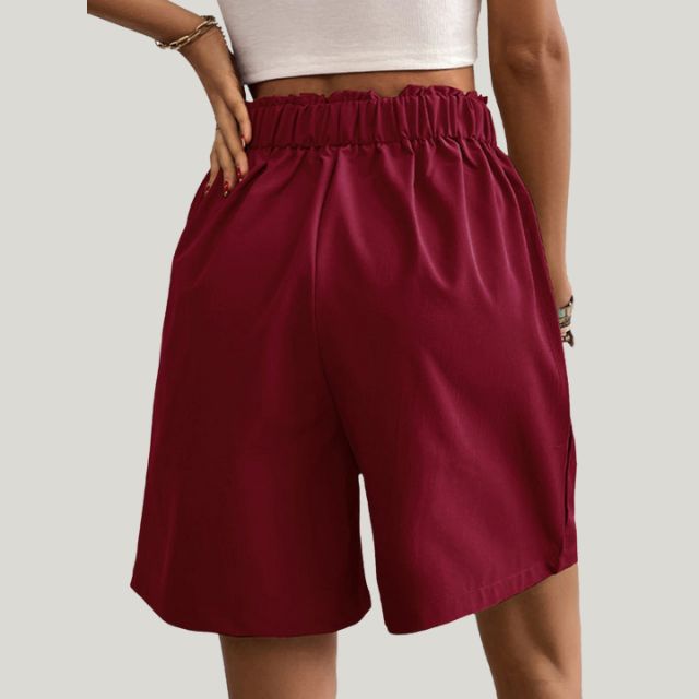 Pleated A-line skirt with button detail