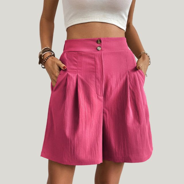 Pleated A-line skirt with button detail