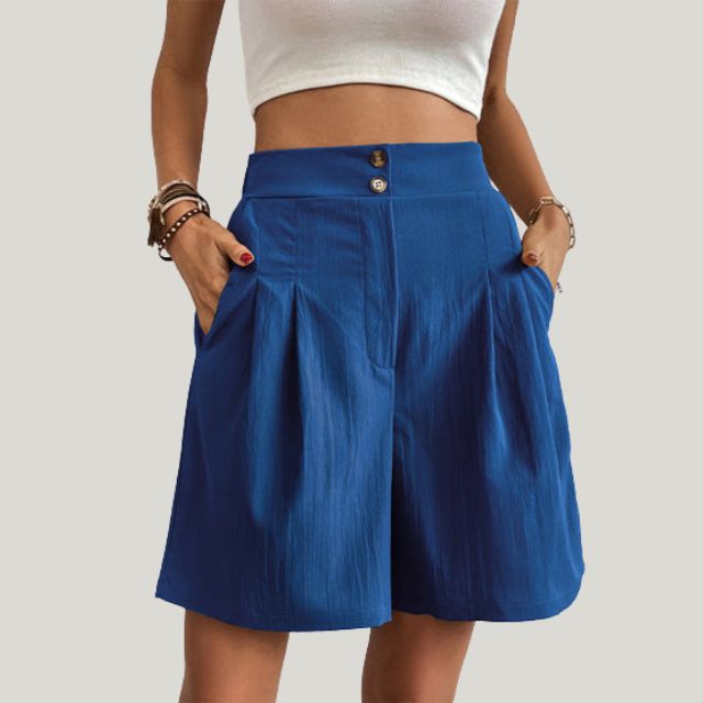 Pleated A-line skirt with button detail