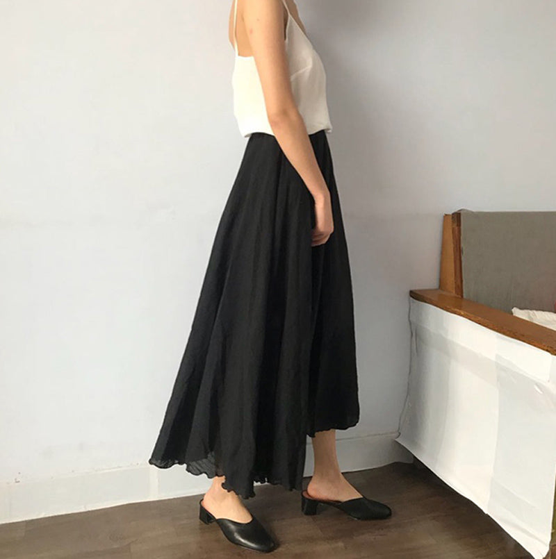 Women's fashion with elasticated high waist and pleated A-line cut