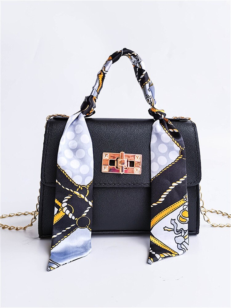 Elegant leather shoulder bag with bandana detail