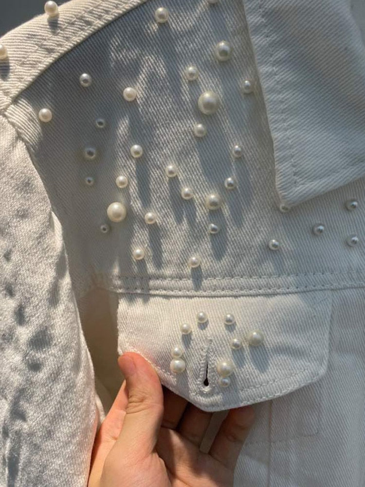 Elegant denim jacket embellished with pearls