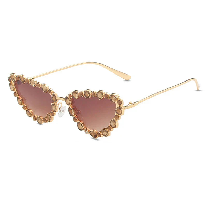 Heart-shaped sunglasses with gemstone embellishments