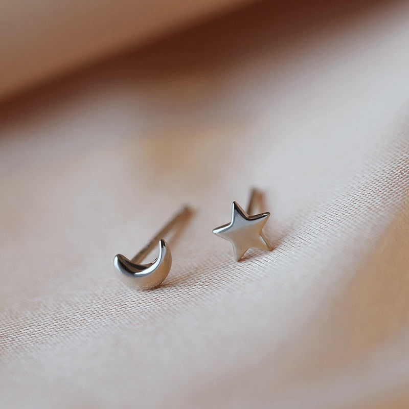 Silver coloured stud earrings for women