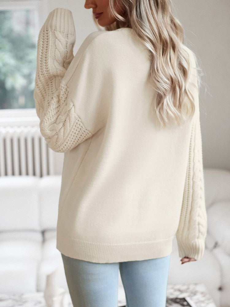 Beige jumper with knitted sleeves