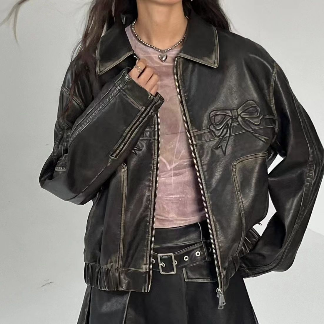 Leather jacket with bow detail