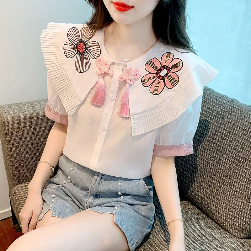 Fashionable summer blouse with embroidery and short sleeves