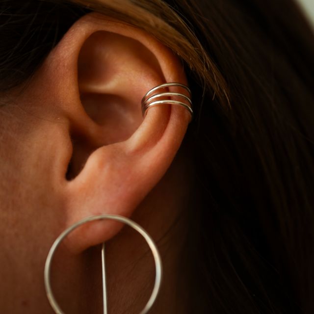 Spiral ear cuff with shiny surface