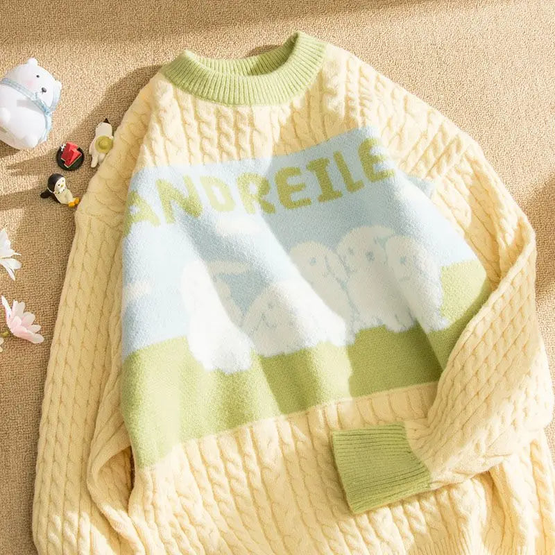 Cable knit jumper with pastel cloud motif