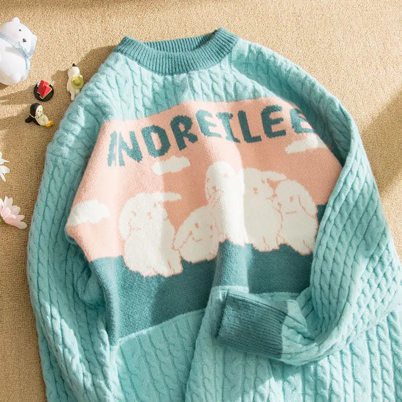 Cable knit jumper with pastel cloud motif