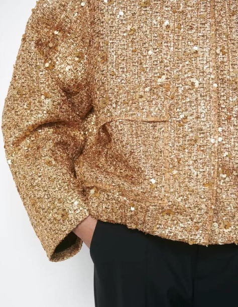 Elegant oversize coat with golden glitter pieces