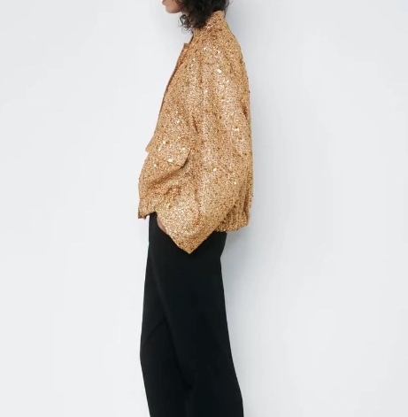 Elegant oversize coat with golden glitter pieces