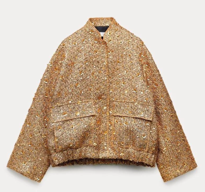 Elegant oversize coat with golden glitter pieces