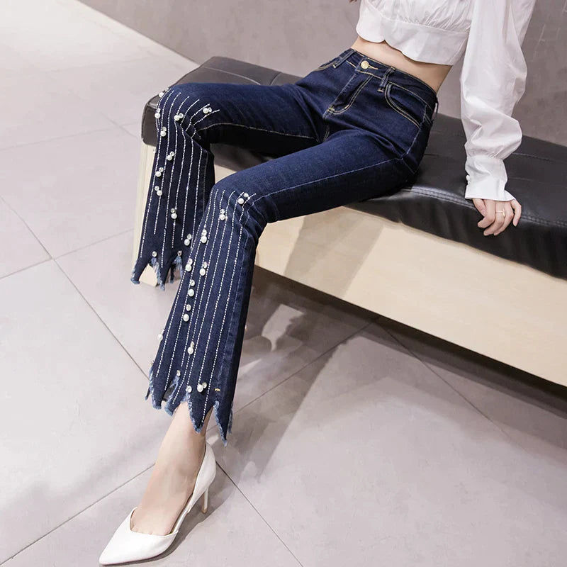 High-waist flare jeans with pearl tassel detail