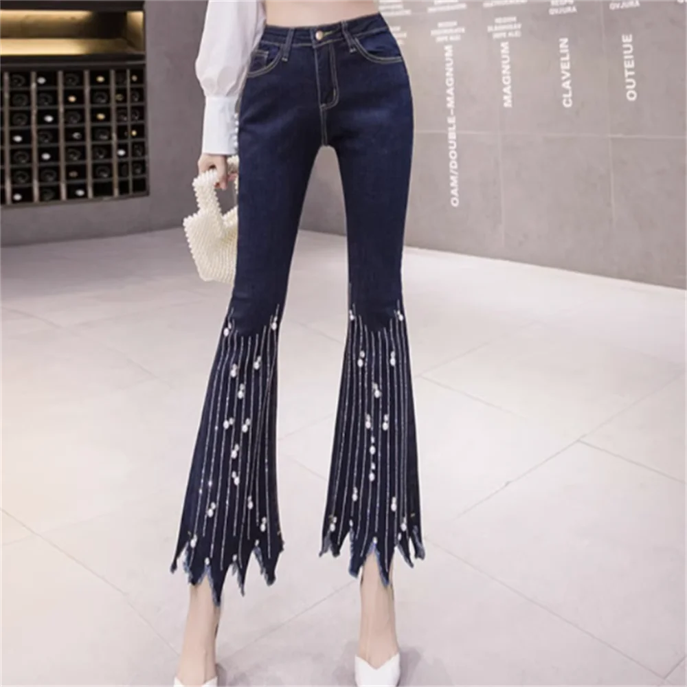 High-waist flare jeans with pearl tassel detail